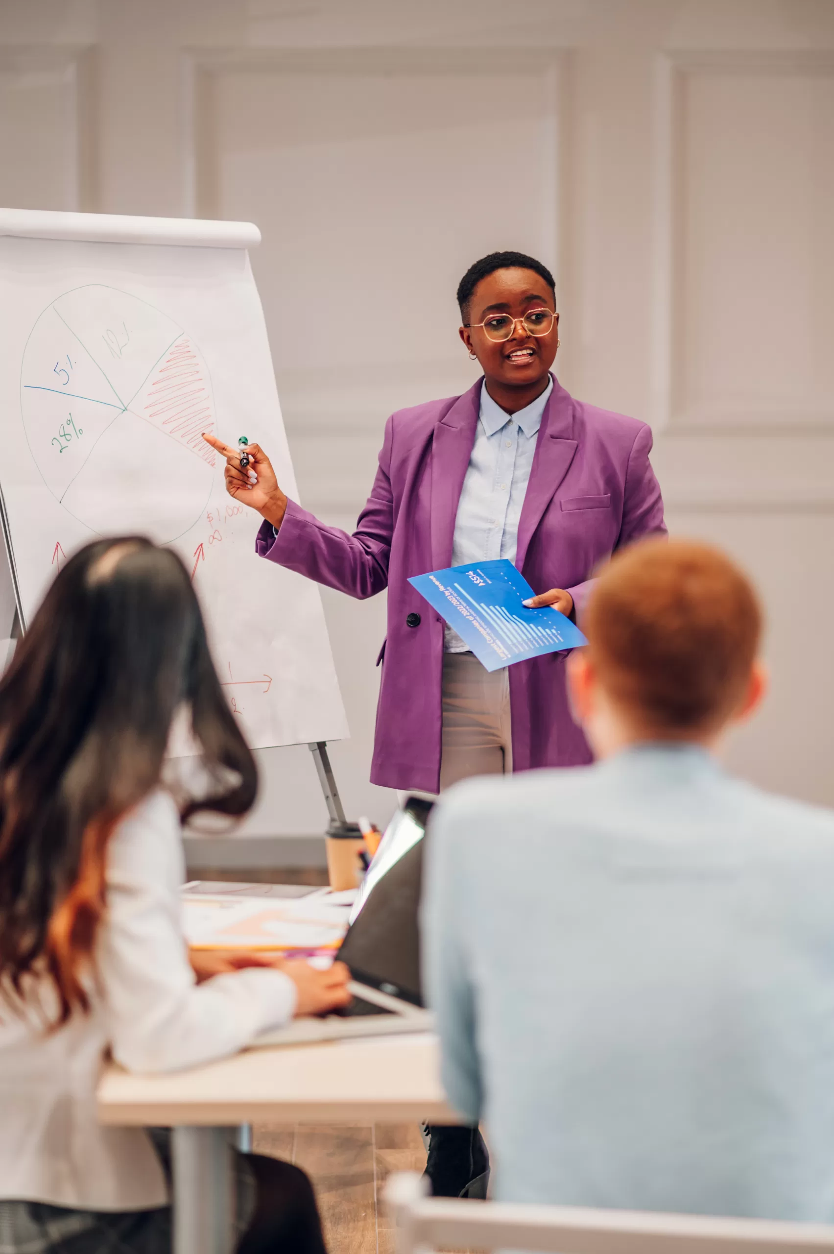 African american businesswoman holding a presentation during a meeting in an office Virtual Coach